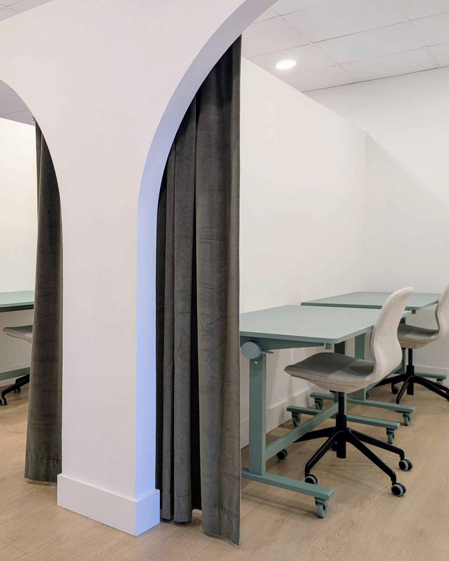 Semi-private curtained booth with two desks at HudsonDesk
